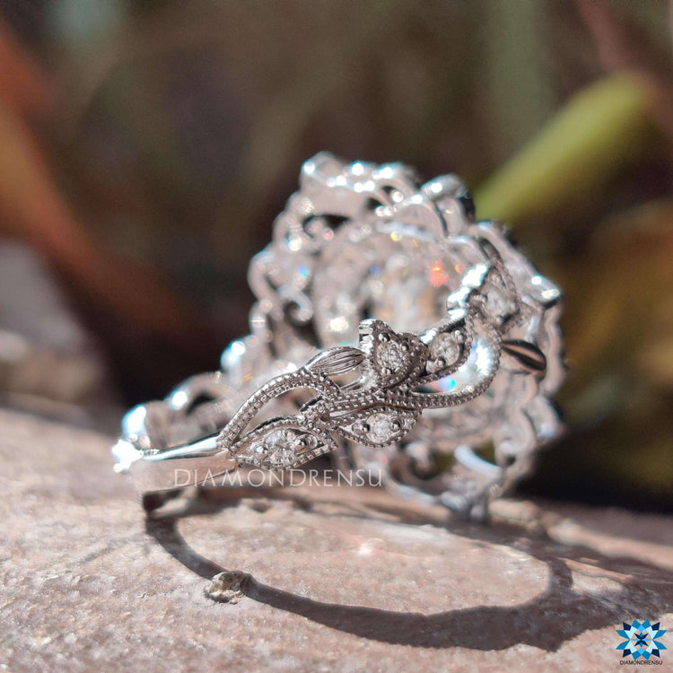 Portuguese cut moissanite ring with milgrain accents.