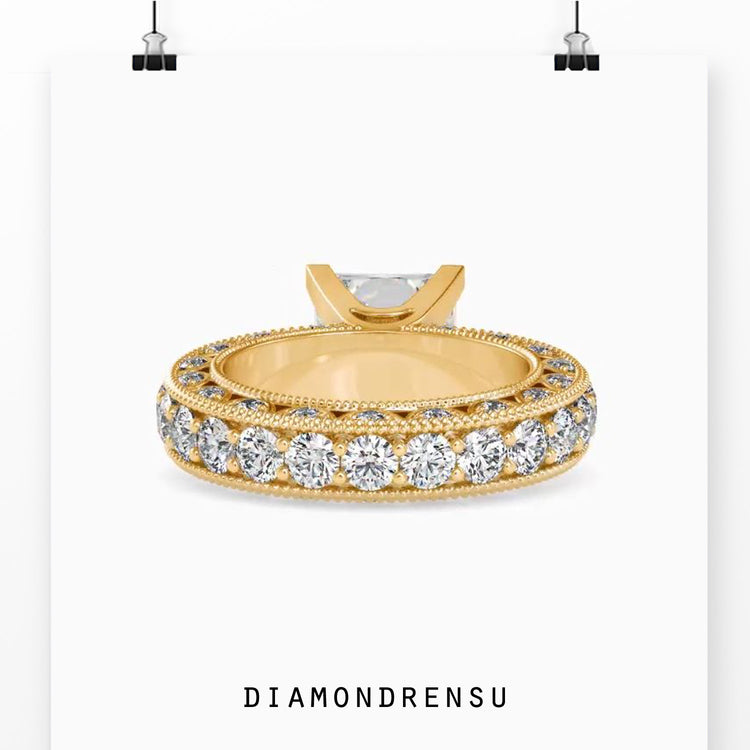 Yellow gold ring with round cut pave band and princess centre.