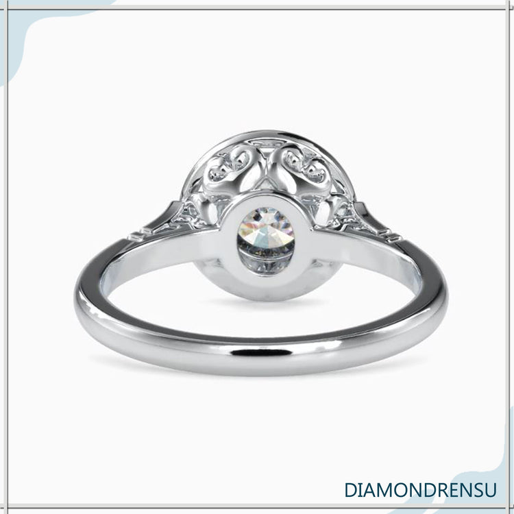 Simple diamond ring with custom round bezel set.