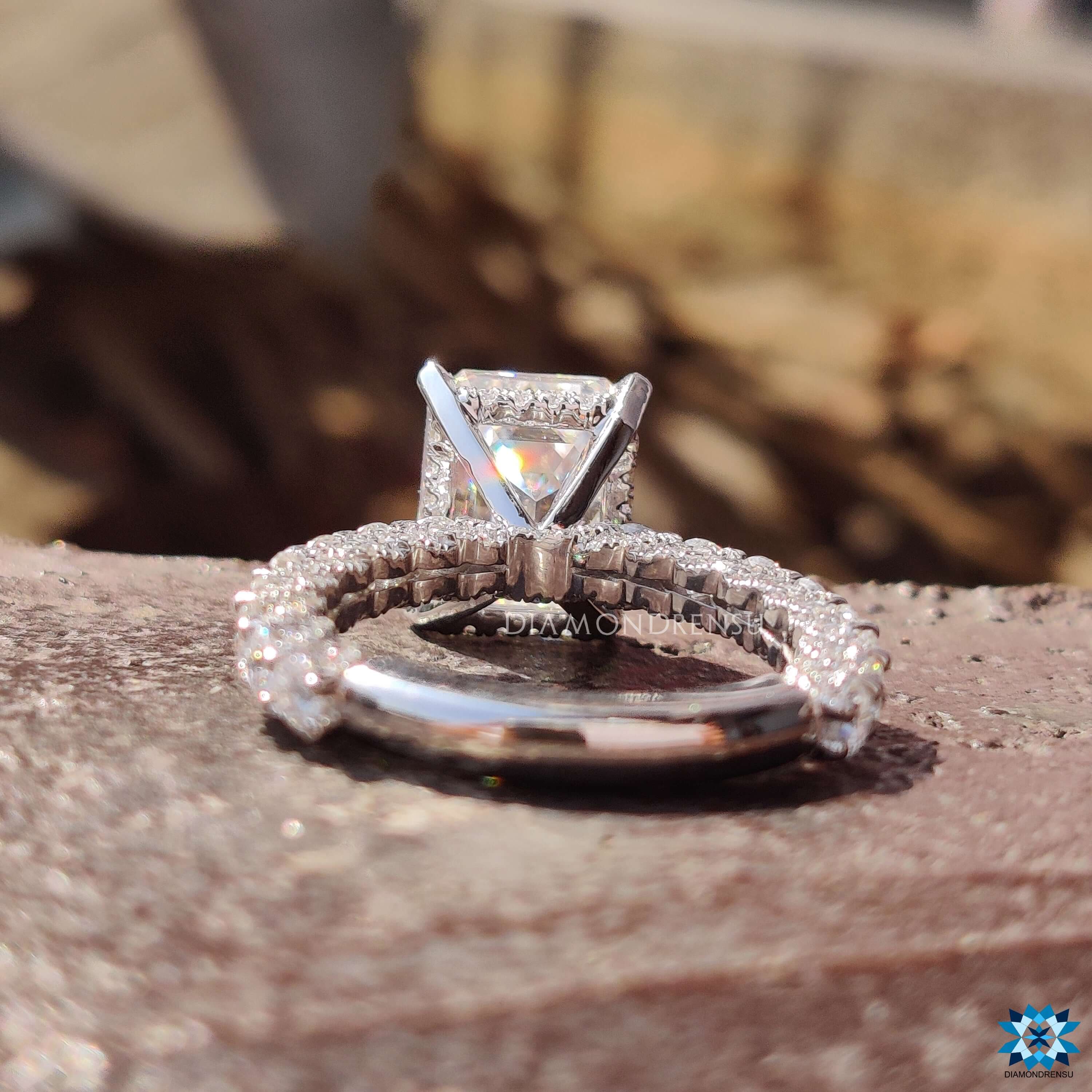 Round cut pave band ring with U-shaped pave design.