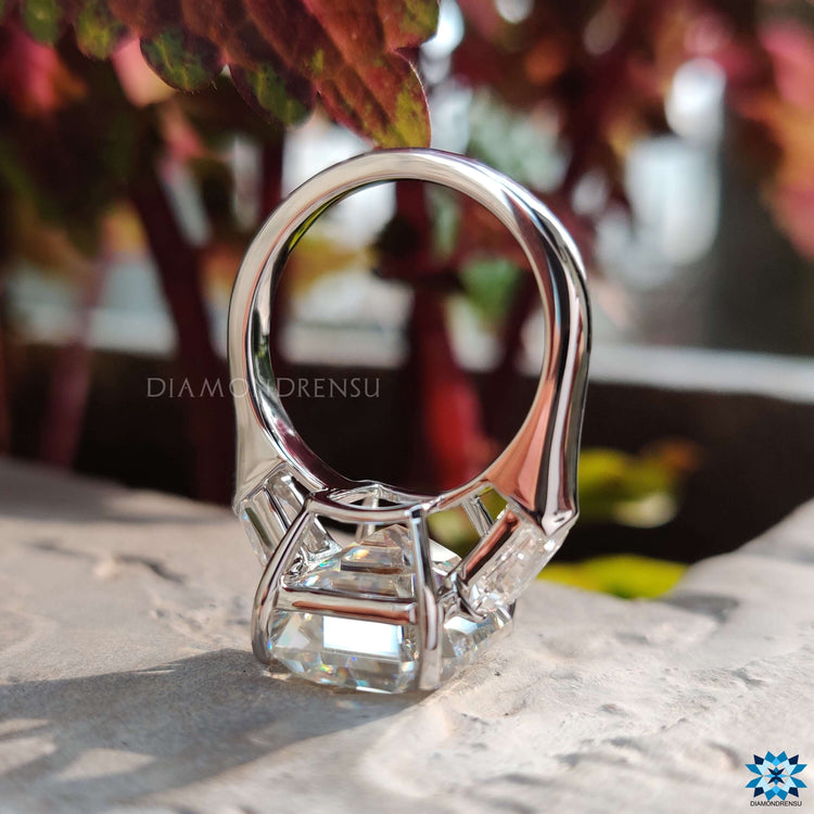 Diamondrensu UK emerald cut moissanite ring in prong setting.