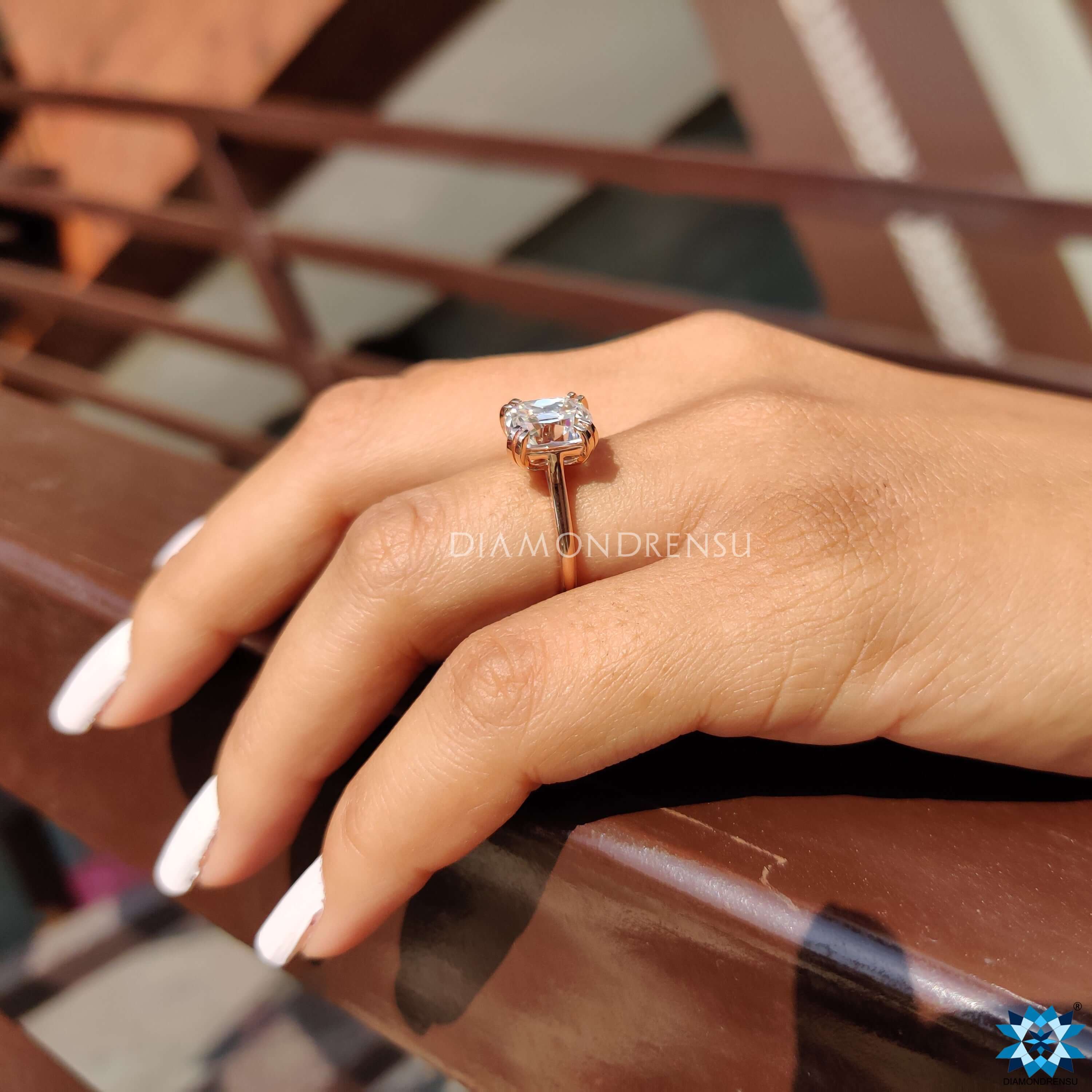 Elongated cushion moissanite ring with double prong mount.