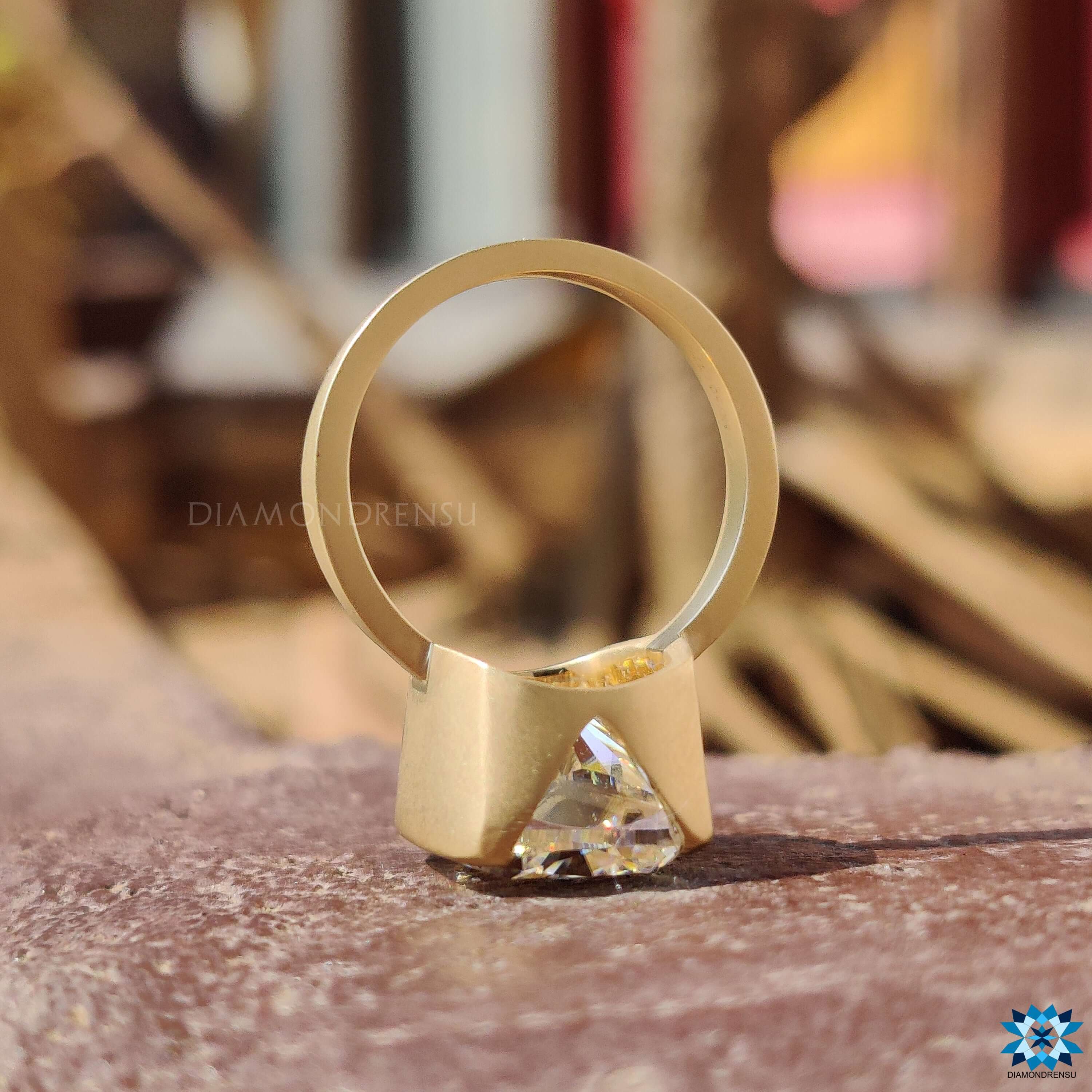 Buy moissanite ring with matte finish and yellow gold band.