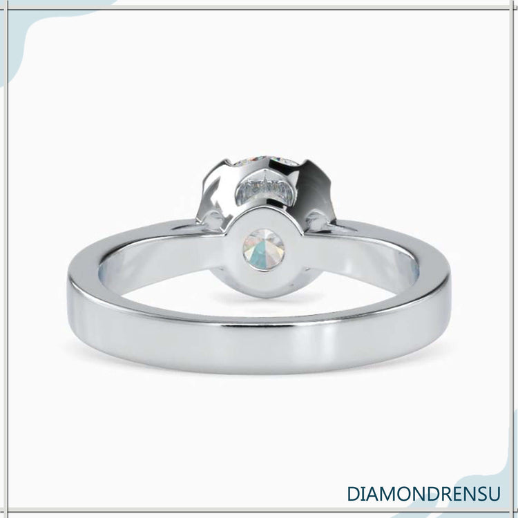 Yellow gold diamond ring with 4 prong and designer finish.