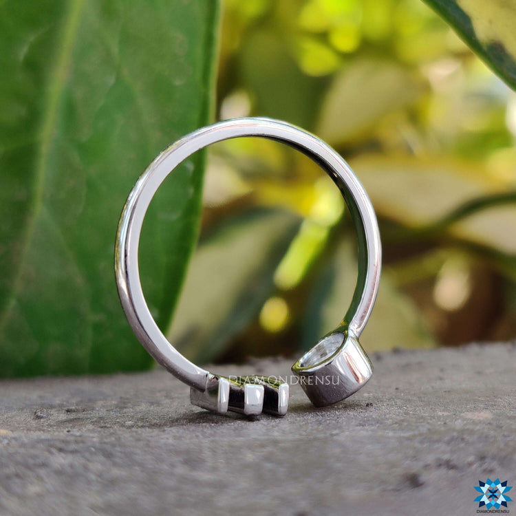 Sleek bezel set moissanite ring for a minimalist yet elegant look.
