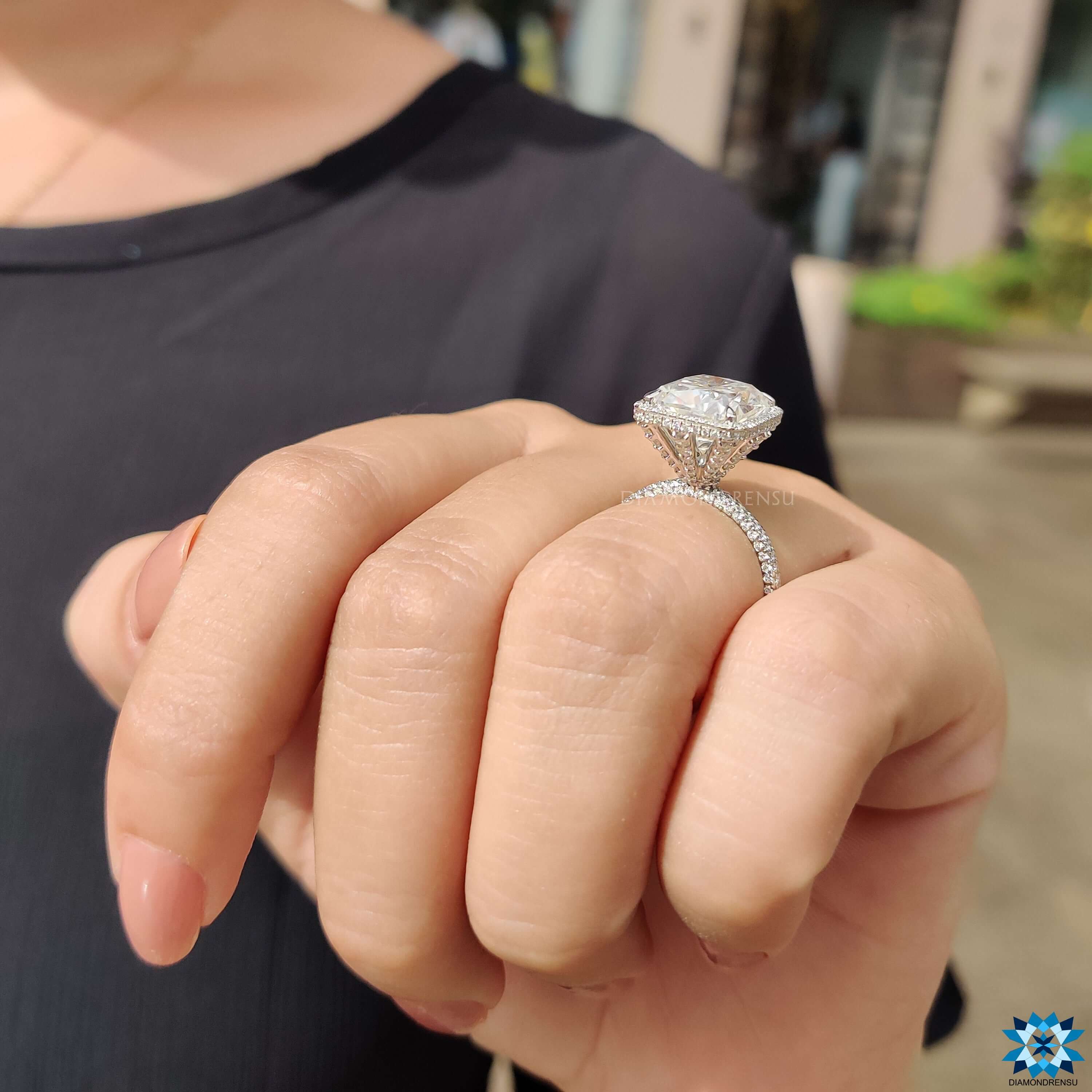 Custom engagement ring with cushion cut moissanite.