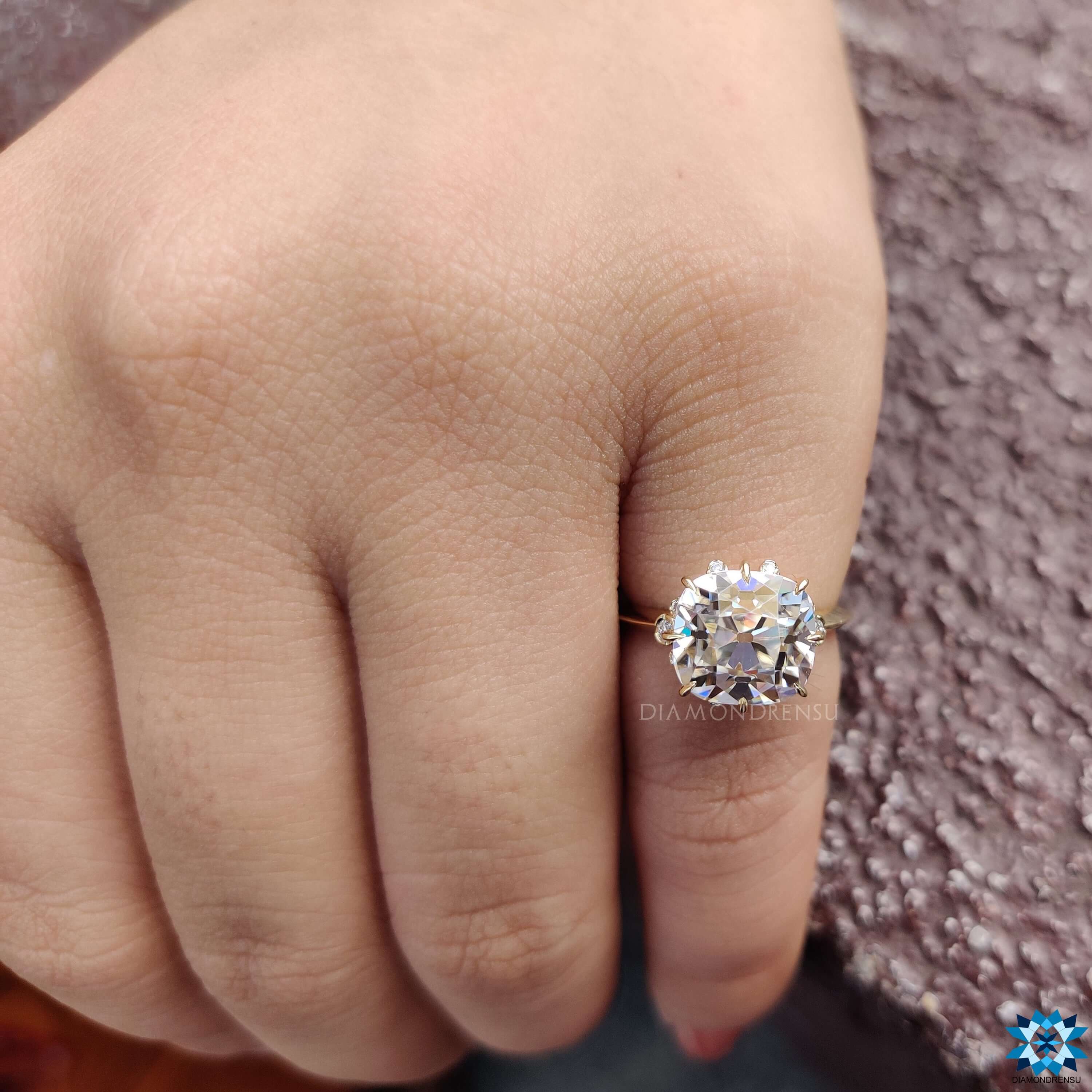 East west set cushion engagement ring with vintage style.