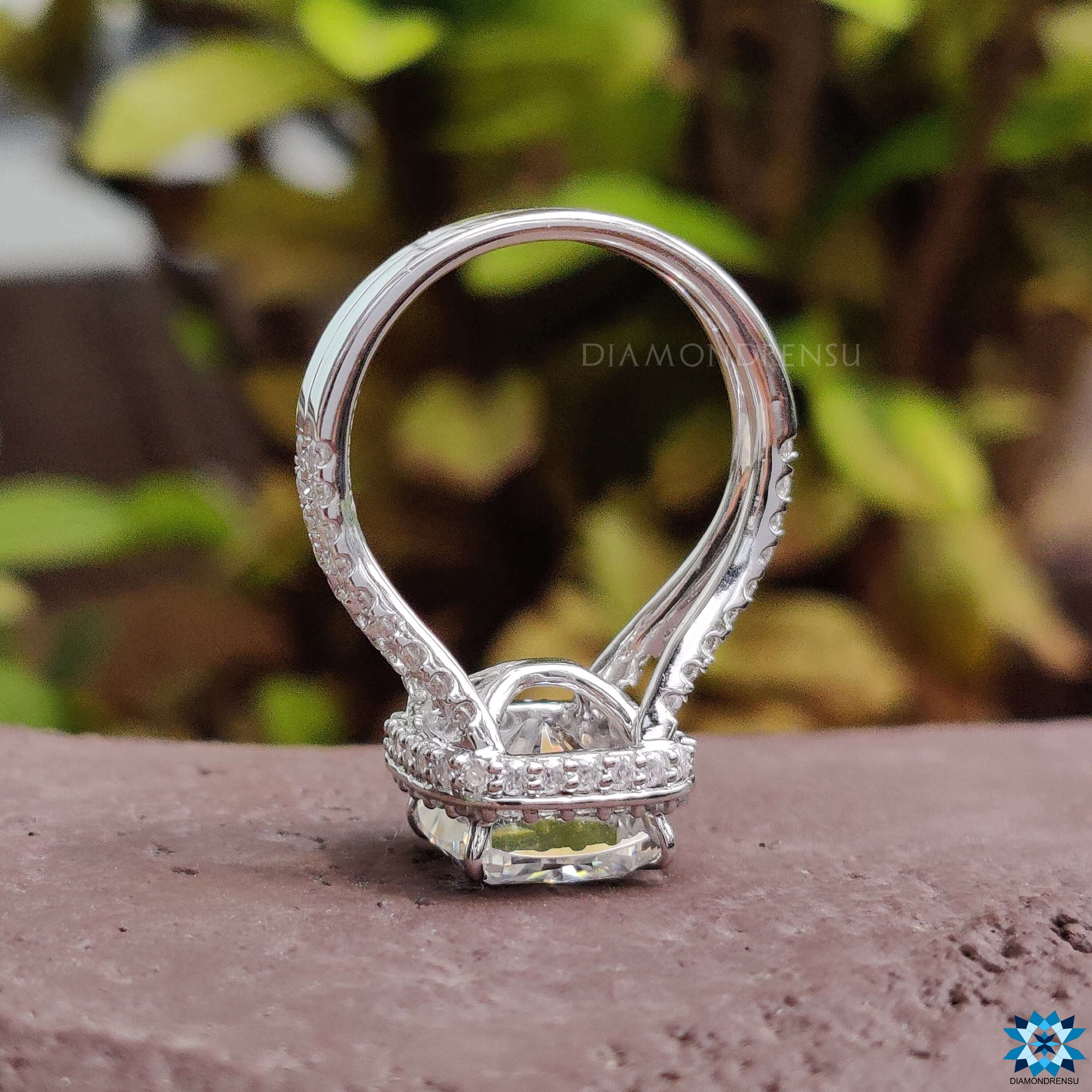 Custom moissanite engagement ring with split shank design.