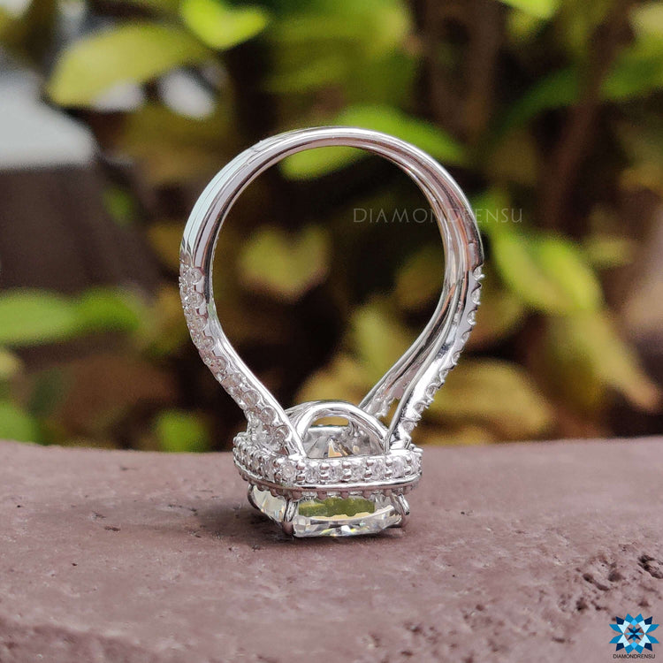 Custom moissanite engagement ring with split shank design.