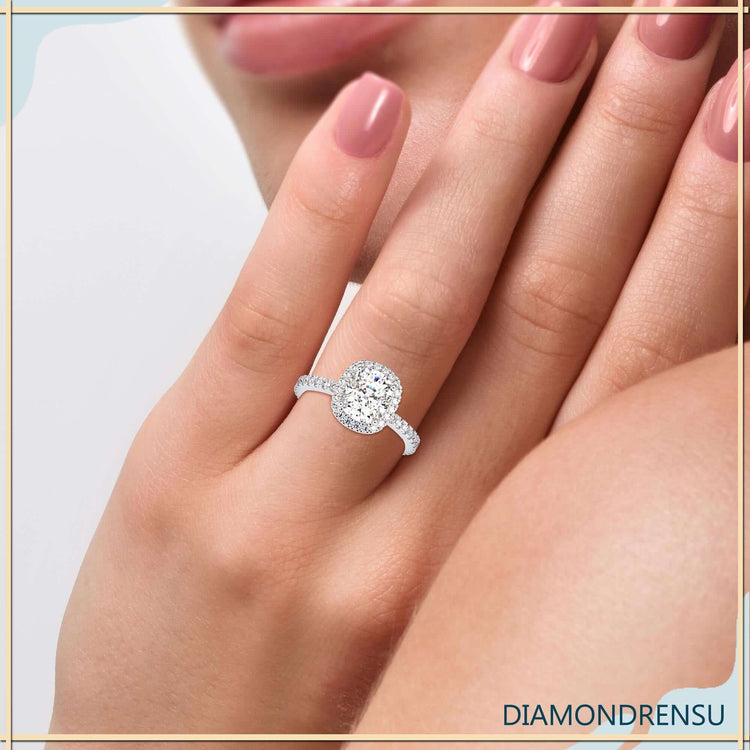 Cushion cut diamond ring with hidden halo setting.