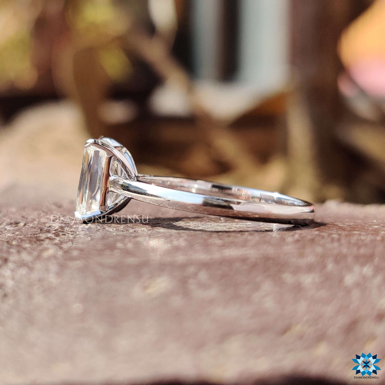 Custom criss cut engagement ring in 4 prong white gold setting.