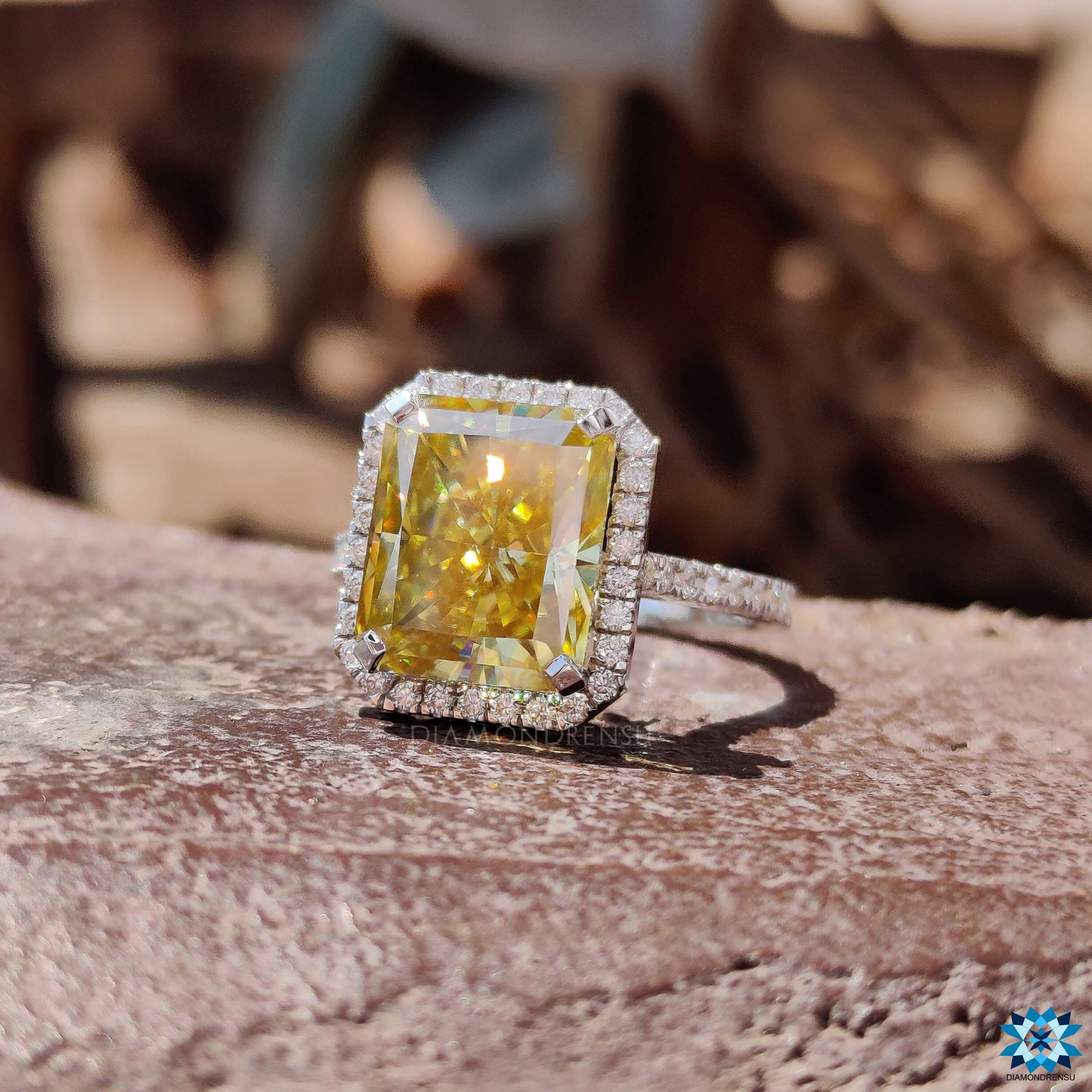Radiant cut yellow moissanite ring with prong setting.