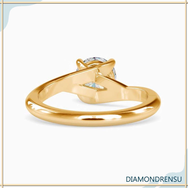 UK diamond ring with lab grown solitaire and round prongs.