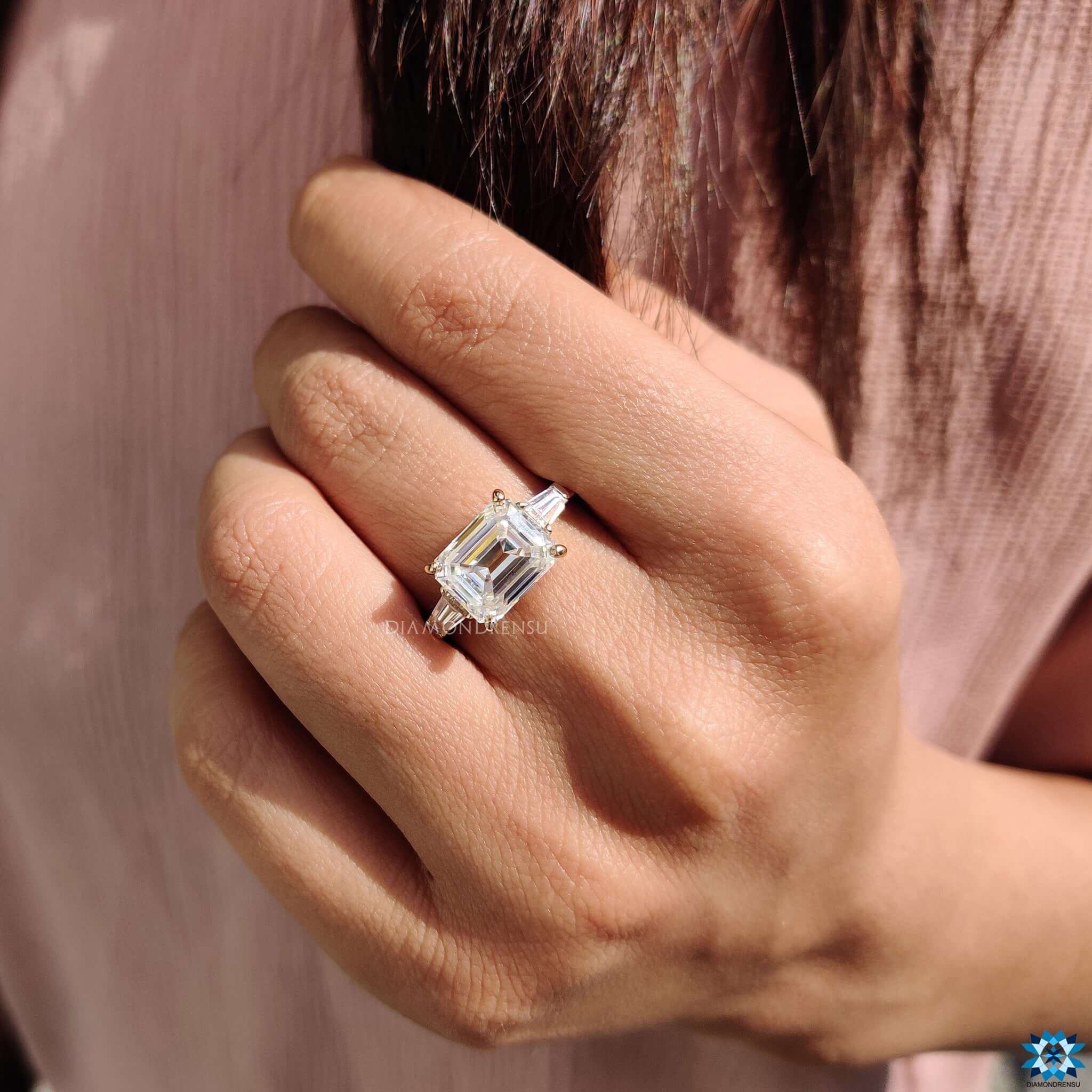 Buy yellow gold three stone moissanite ring.