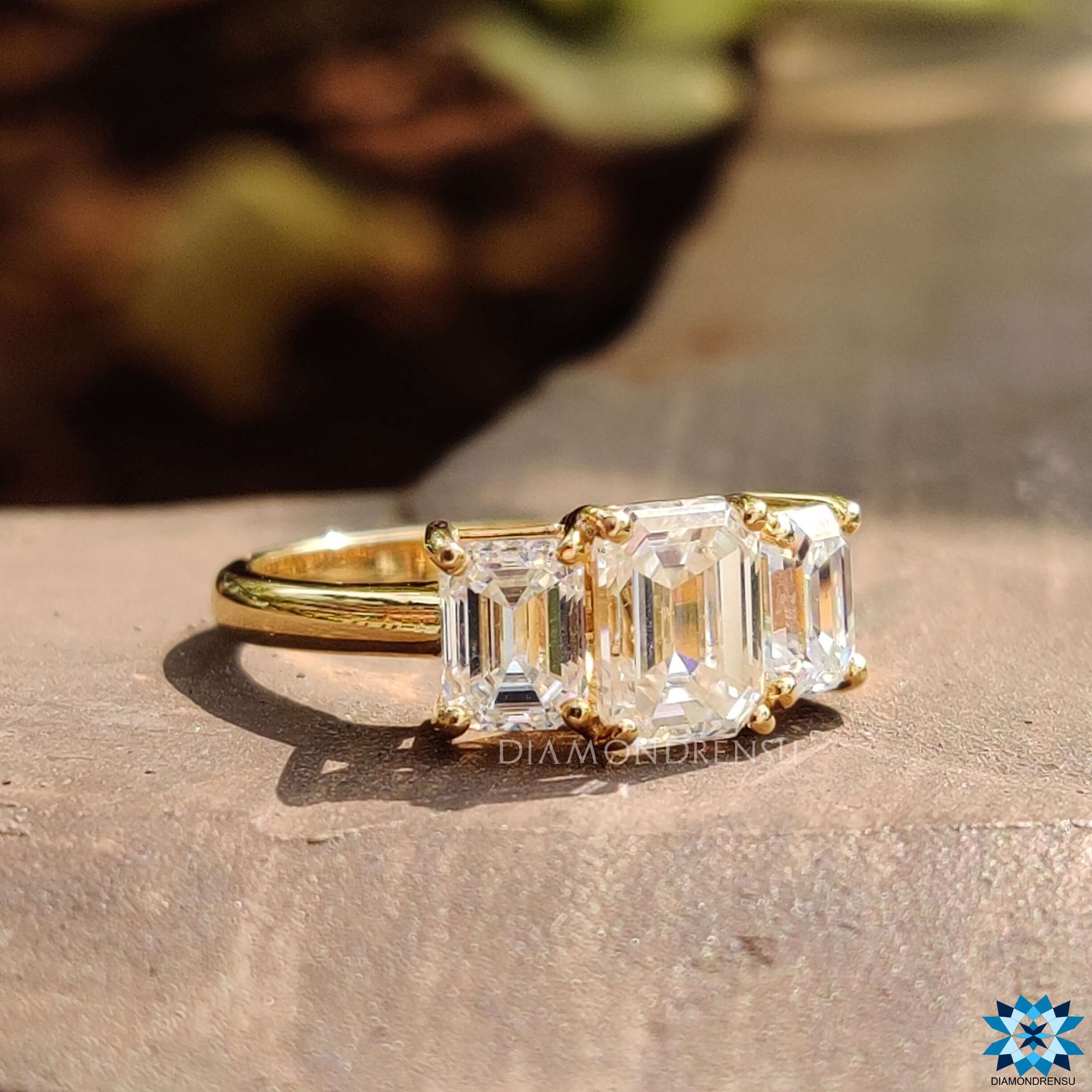 Prong setting three stone engagement ring