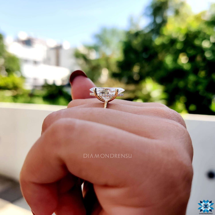 Handmade engagement ring with marquise center stone.