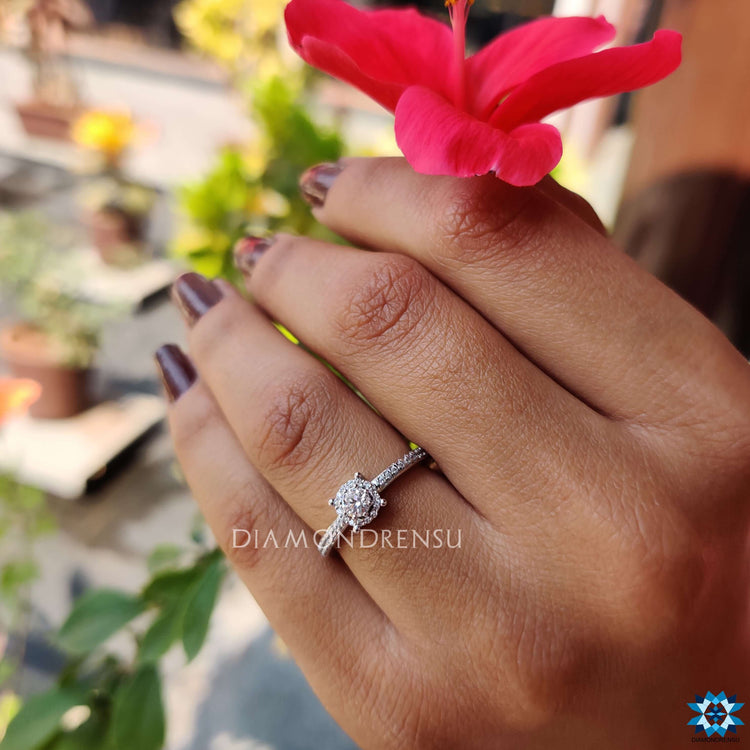White gold engagement ring with moissanite center.