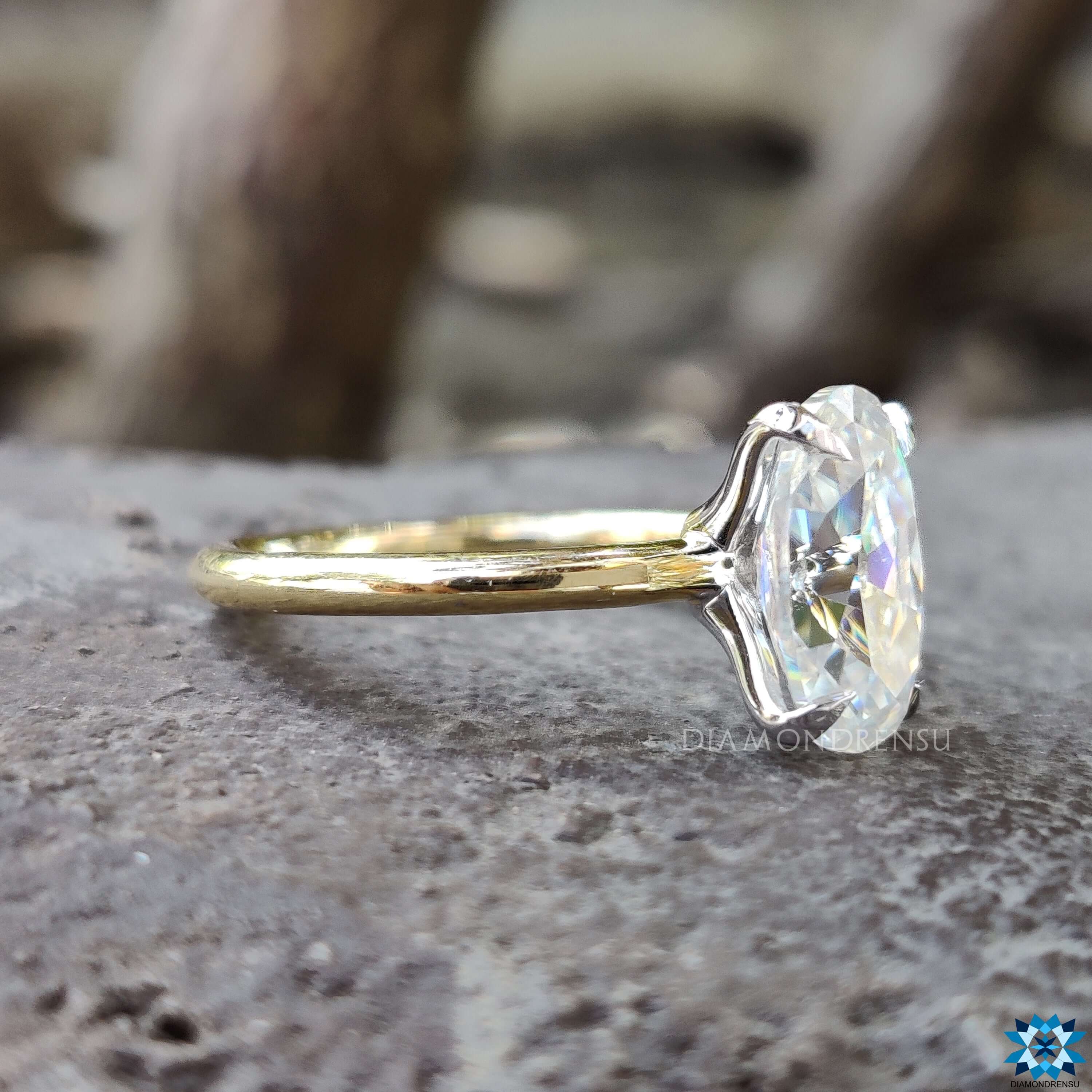 Handmade yellow gold solitaire moissanite ring.