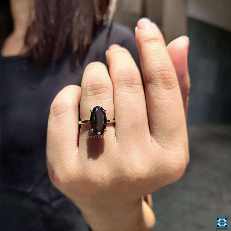 4 prong setting ring featuring moval moissanite.