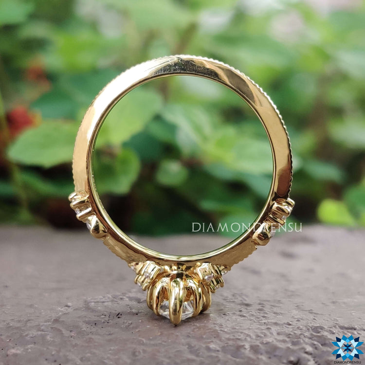 Custom marquise moissanite ring with milgrain detailing.