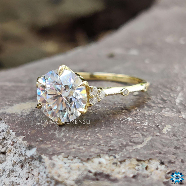Handmade round moissanite ring with prong setting.
