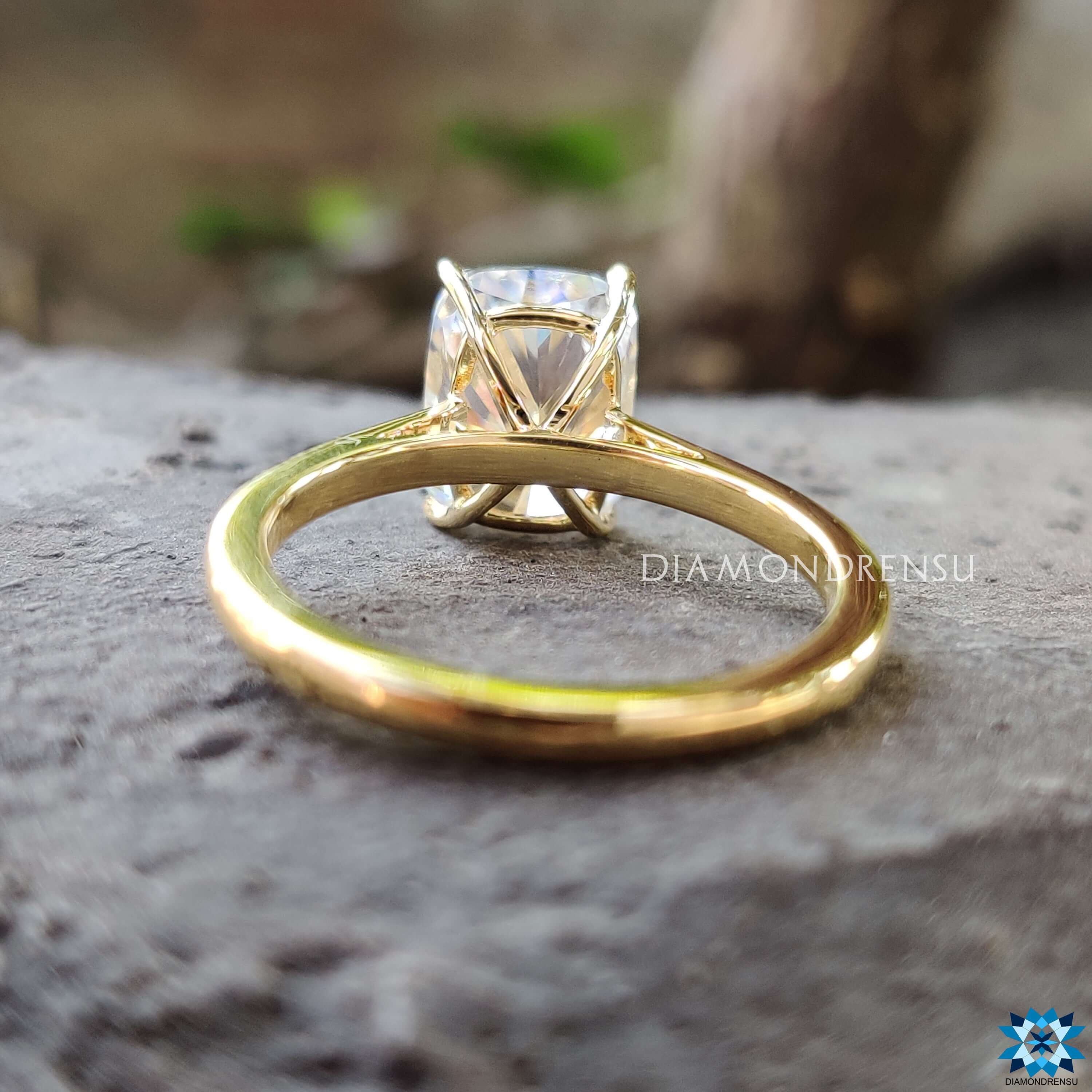 Handmade cushion moissanite ring with 4 claw prong setting.