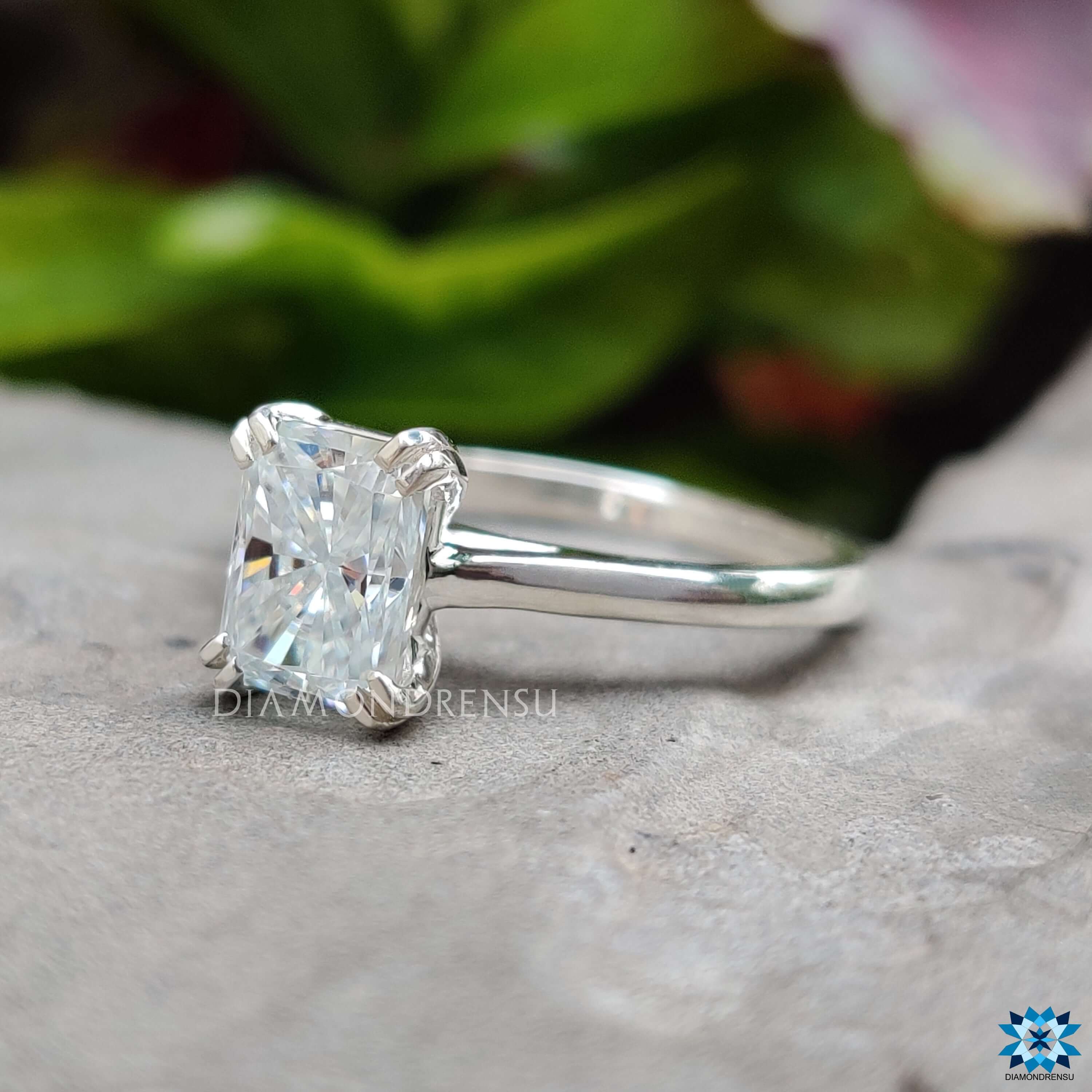 Handmade engagement ring with radiant moissanite and double prongs.
