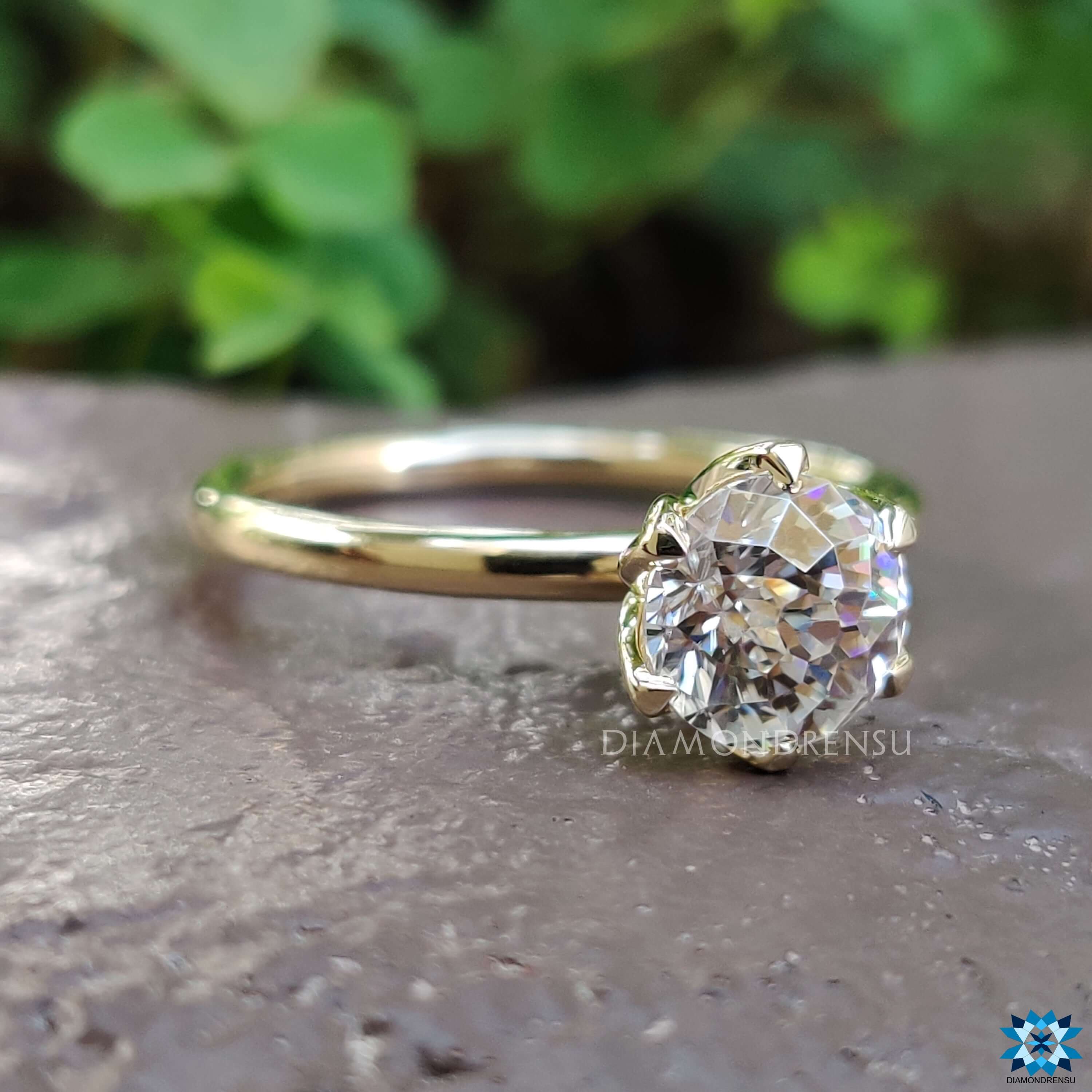 Handmade tulip prong moissanite engagement ring.