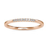 Round cut diamond gold band with 1/4 eternity style.