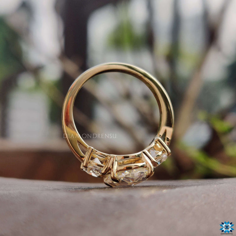 Three stone engagement ring in rose gold.