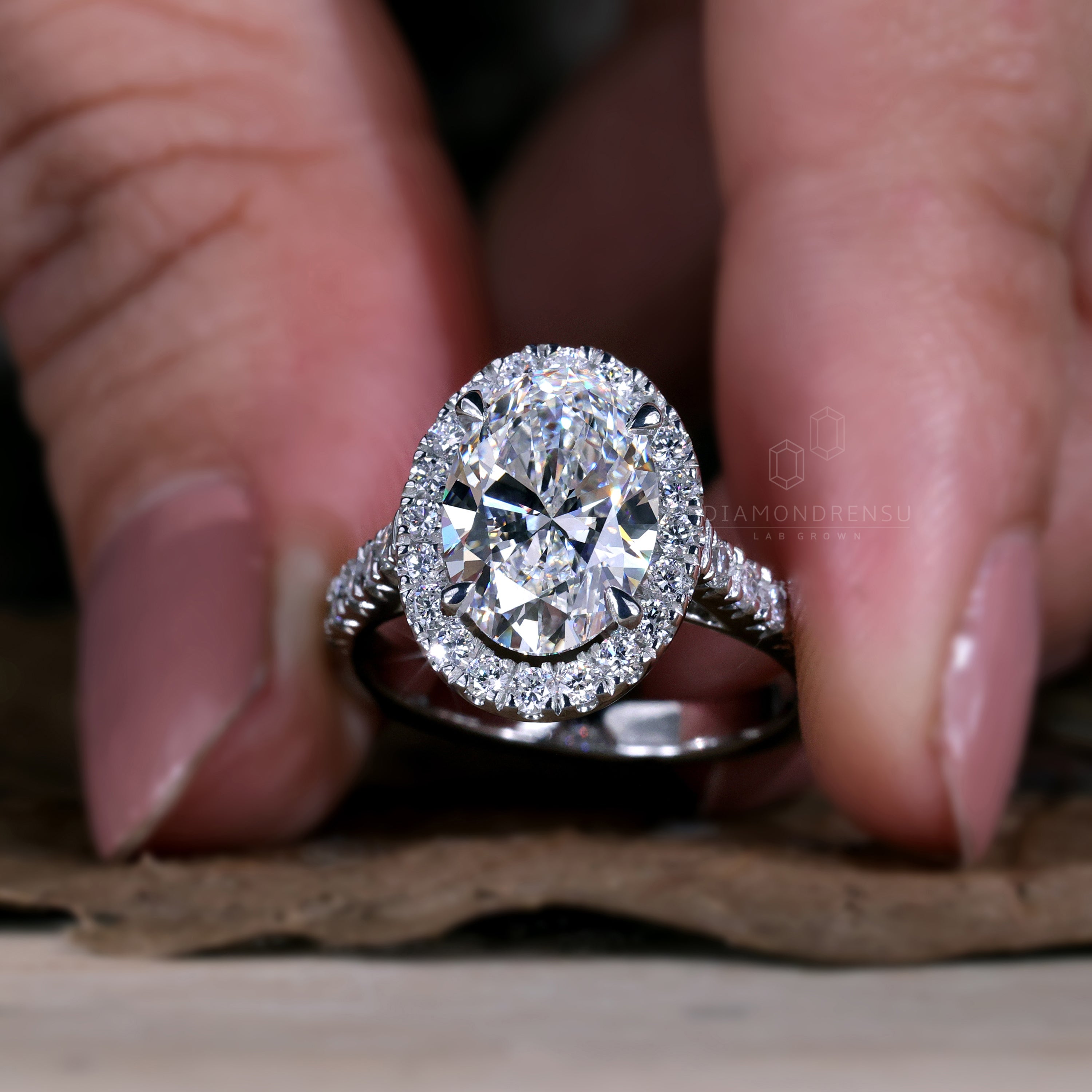 Unique oval pave engagement ring with diamondrensu uk touch.