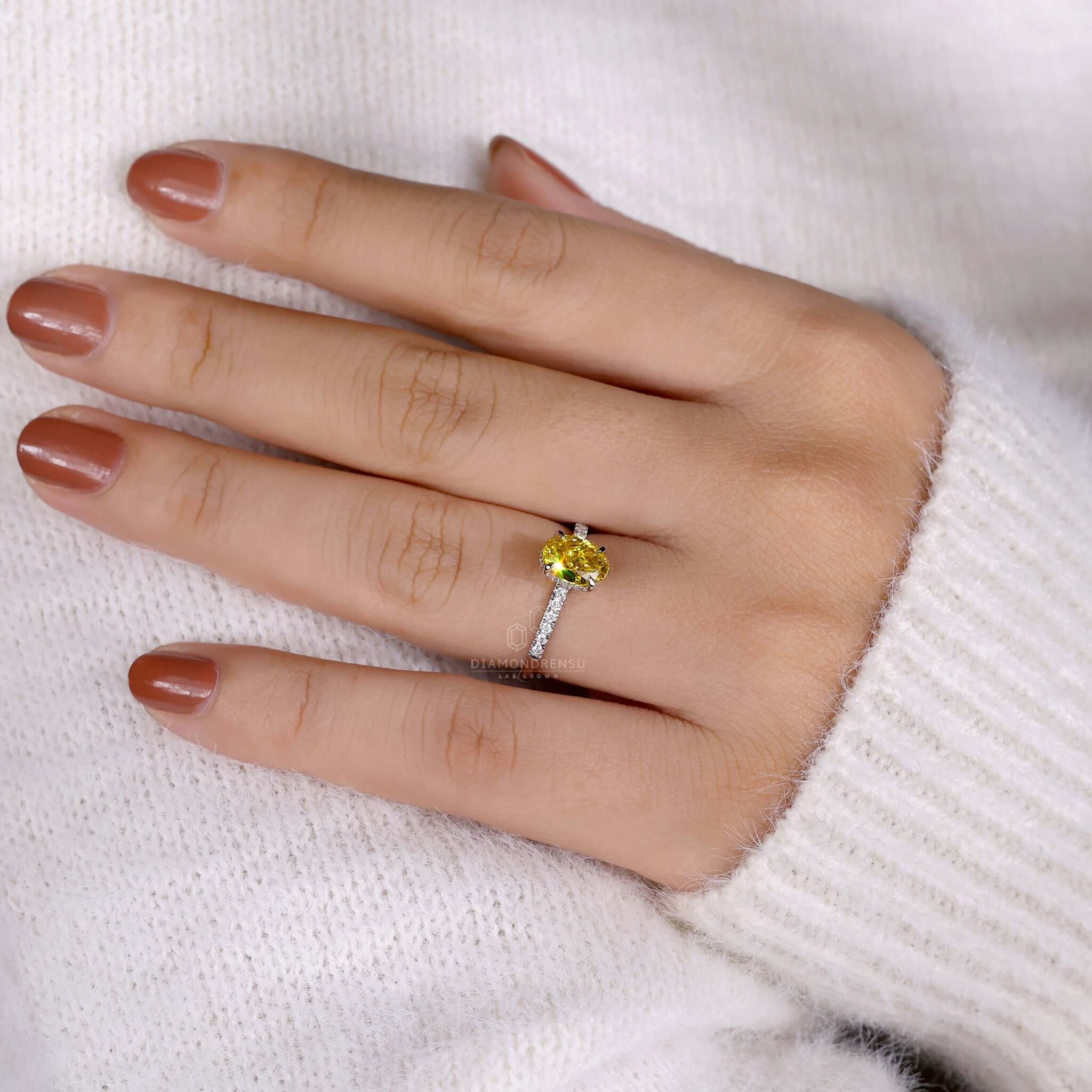 Diamond engagement ring yellow featuring an oval diamond in a 4 prong claw setting for timeless beauty.