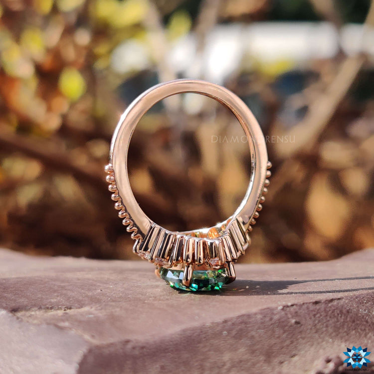 Muse engagement ring featuring green oval moissanite.