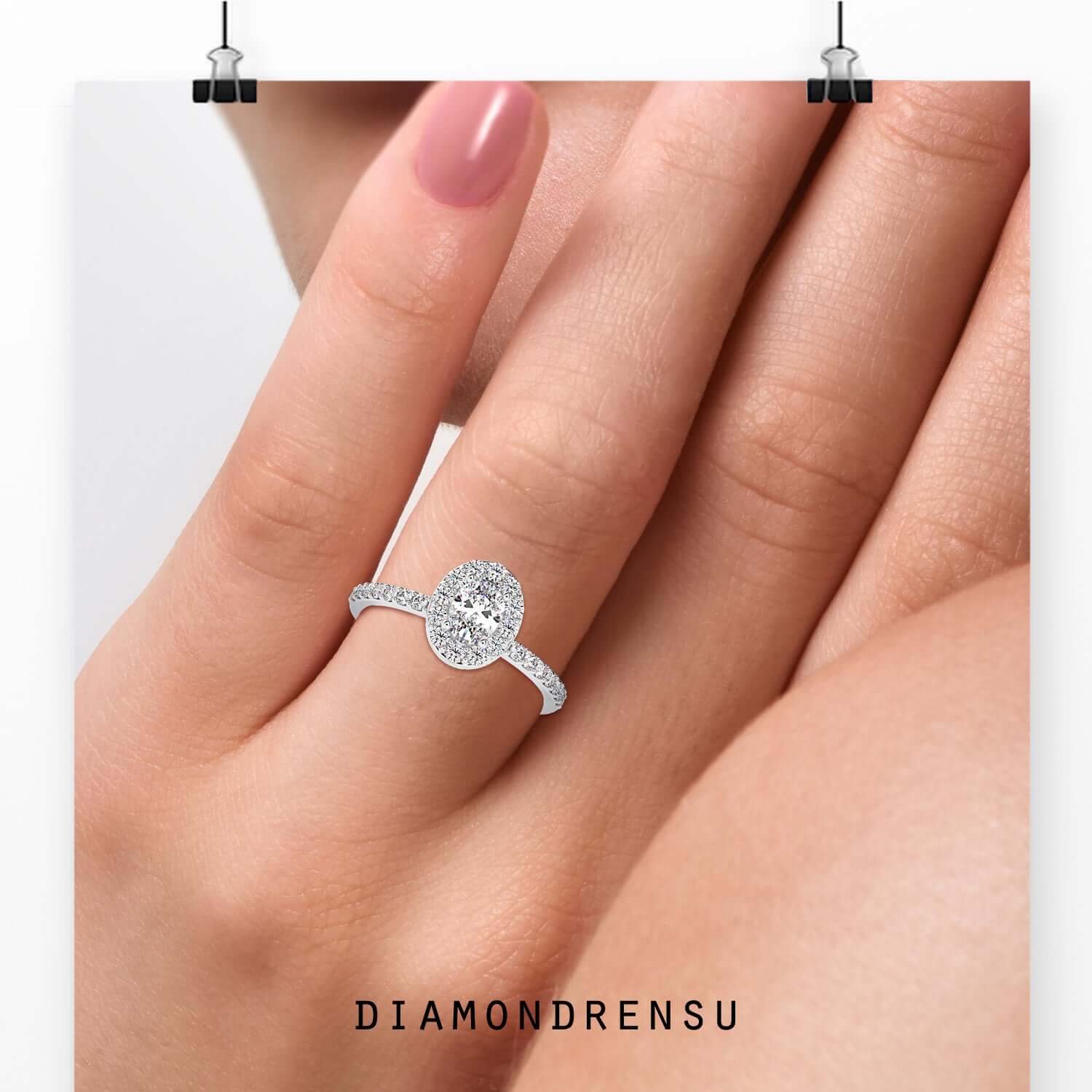 Oval halo ring with lab grown centre diamond and pave band.