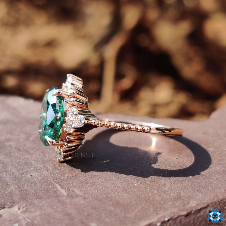 Oval cut moissanite ring with round cut side stones.