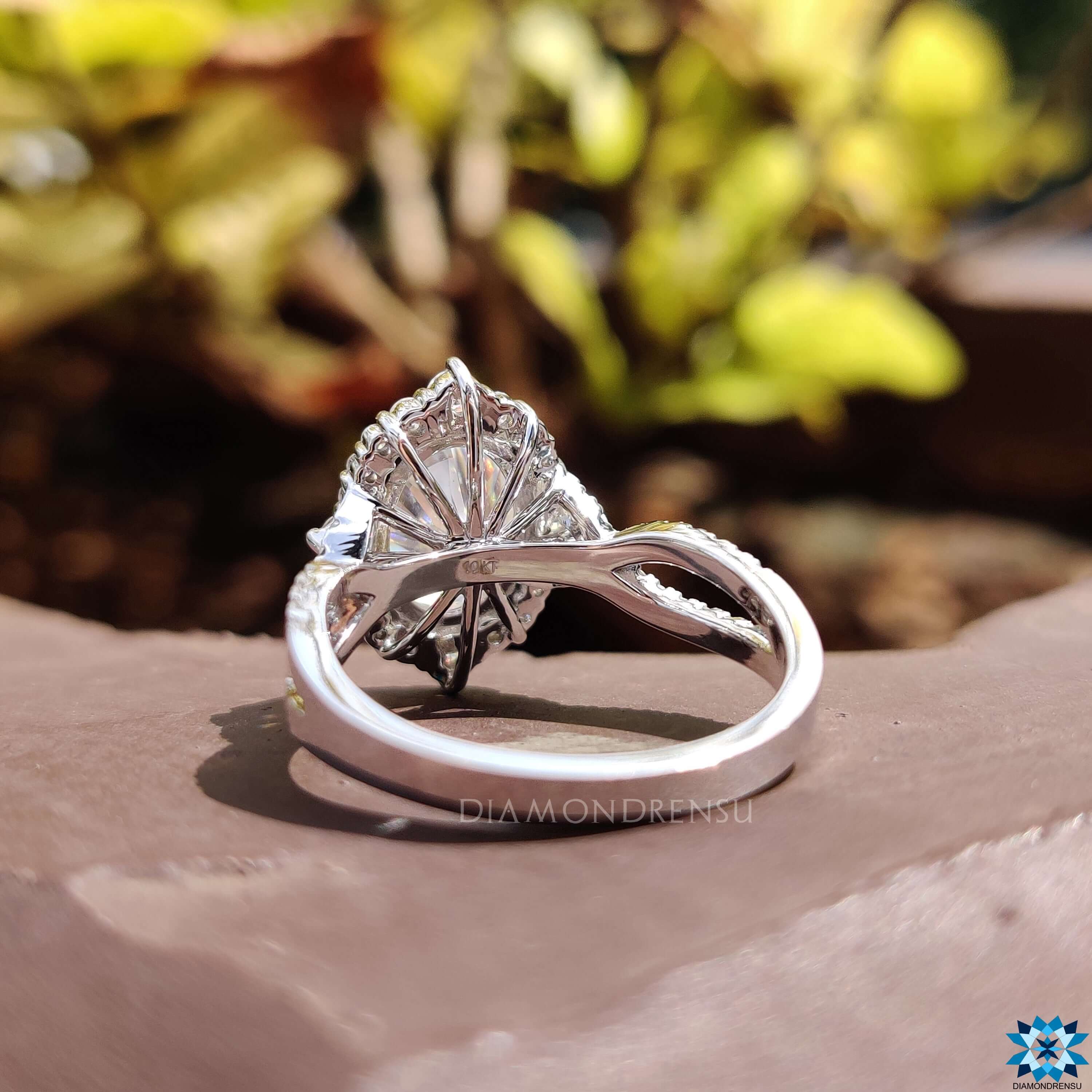 Custom engagement ring with oval crushed ice moissanite.