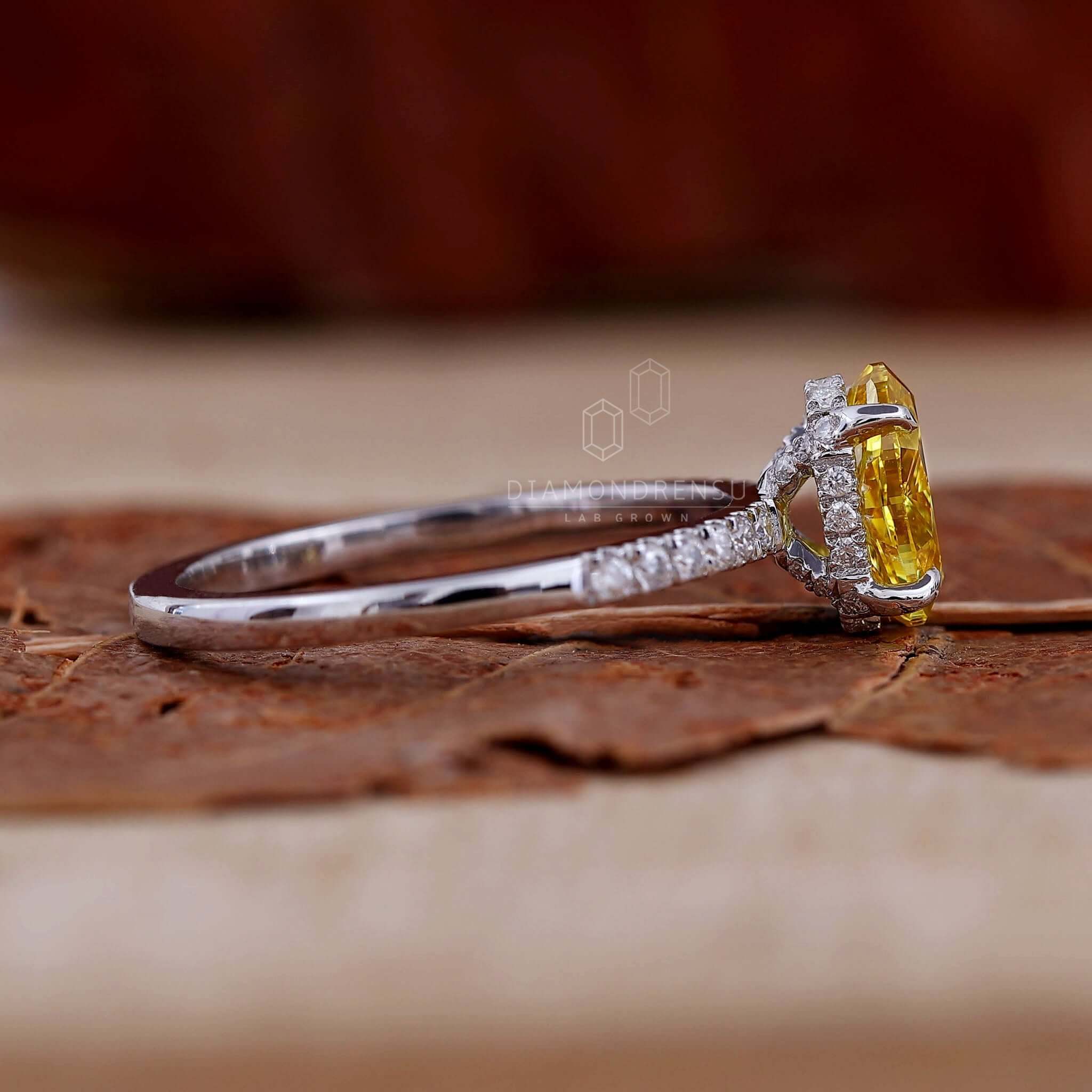 Yellow diamond engagement ring crafted with pave diamonds in a unique and sophisticated UK engagement ring design.
