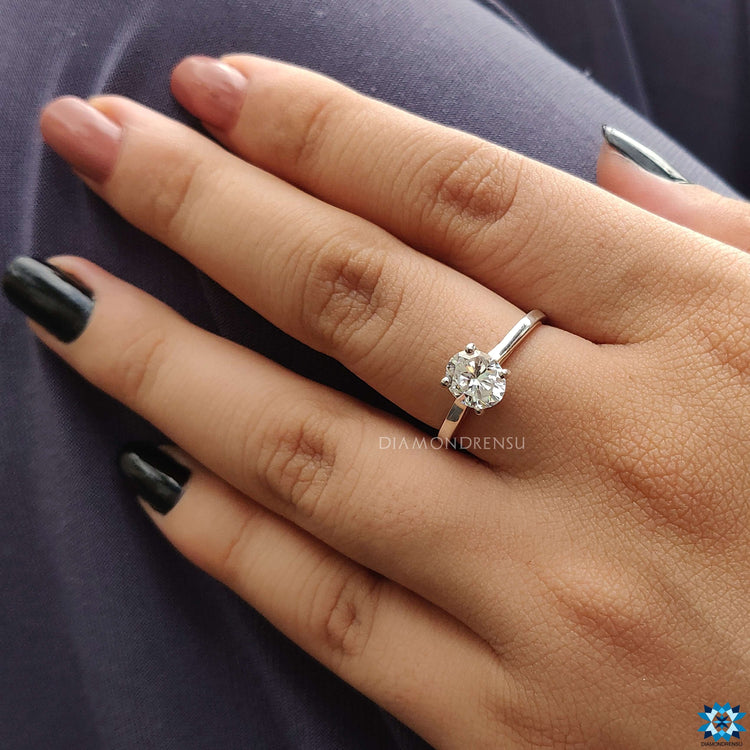 Buy engagement ring in the UK with a handmade oval moissanite design.