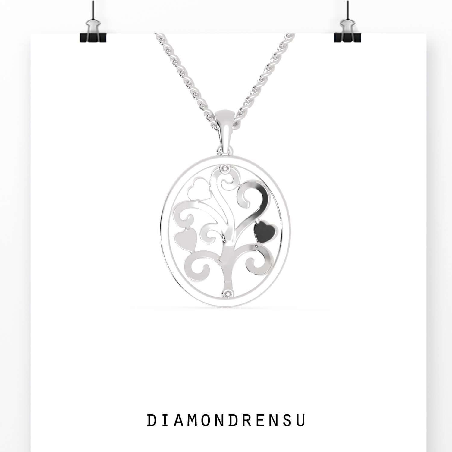 Handmade jewellery pendant in oval frame with tree of life.