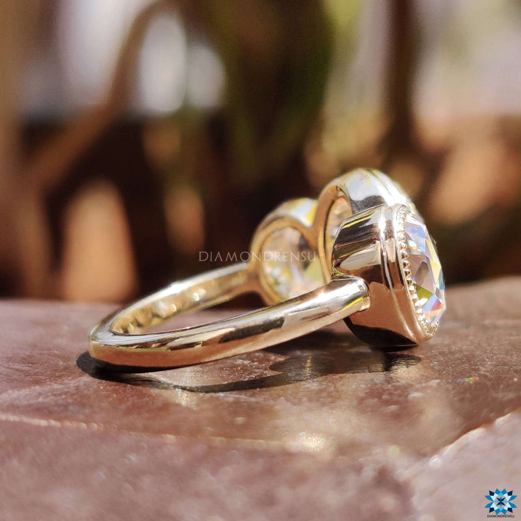 Three stone rose cut ring with milgrain detail.