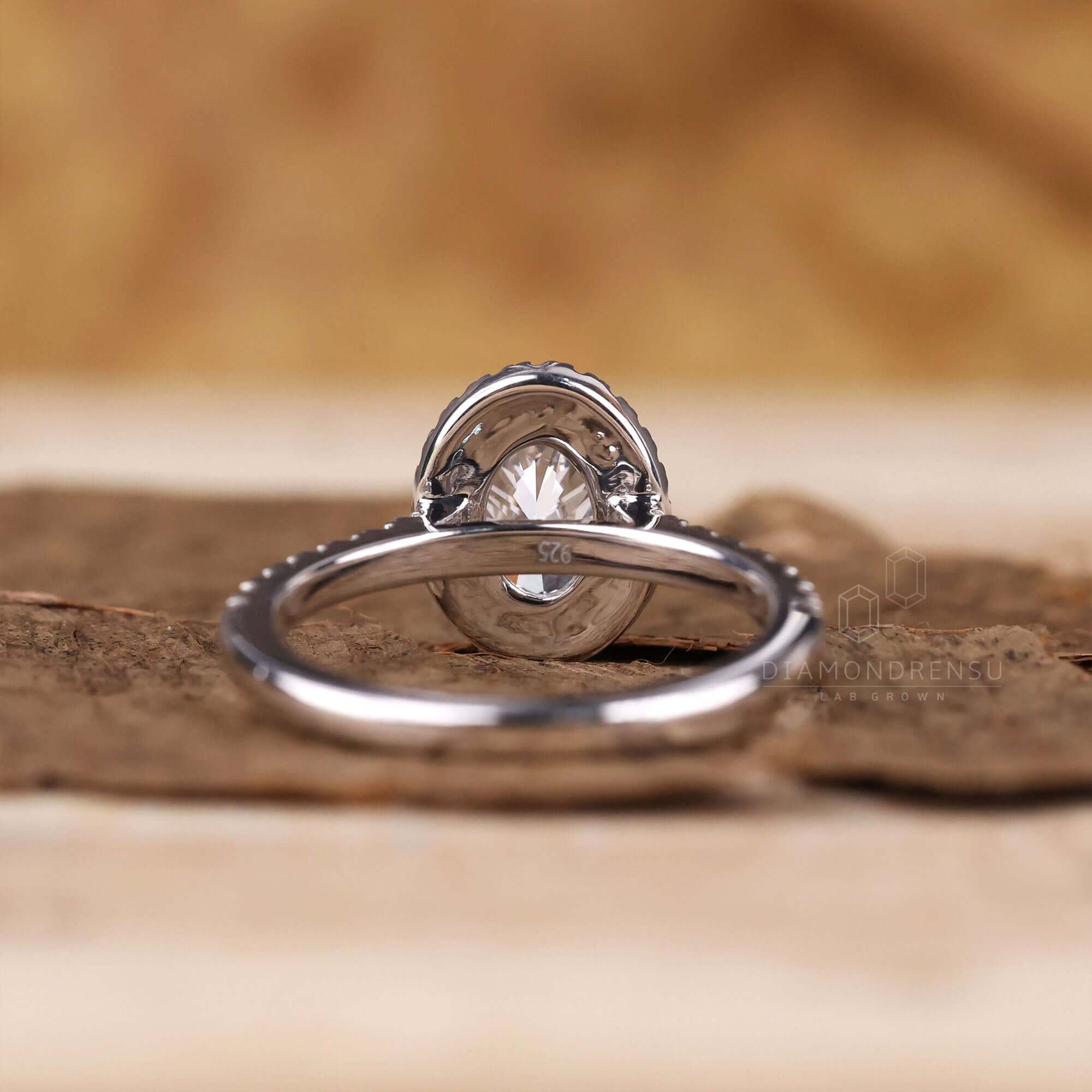 White gold engagement ring with a 4 prong diamond setting.