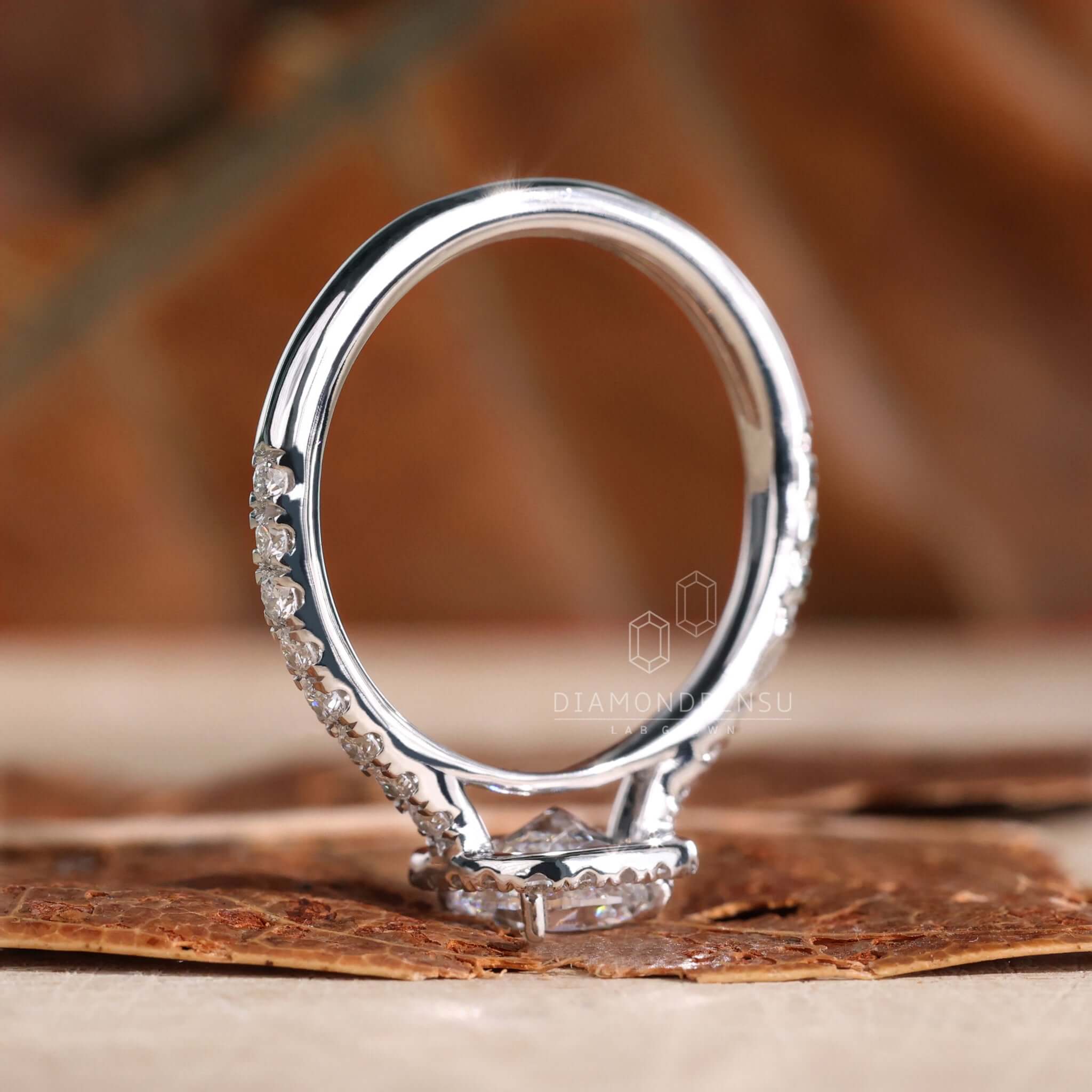 Elongated cushion cut diamond in a stunning cathedral ring setting