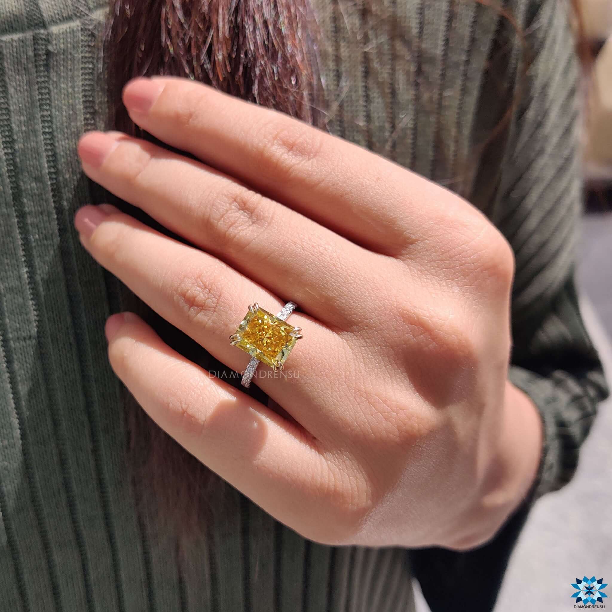 Round cut moissanite ring with hidden halo.