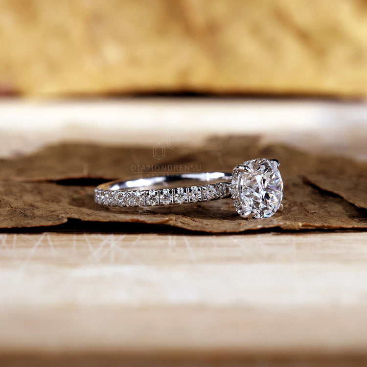 Pave ring diamond with exquisite details and a radiant finish.
