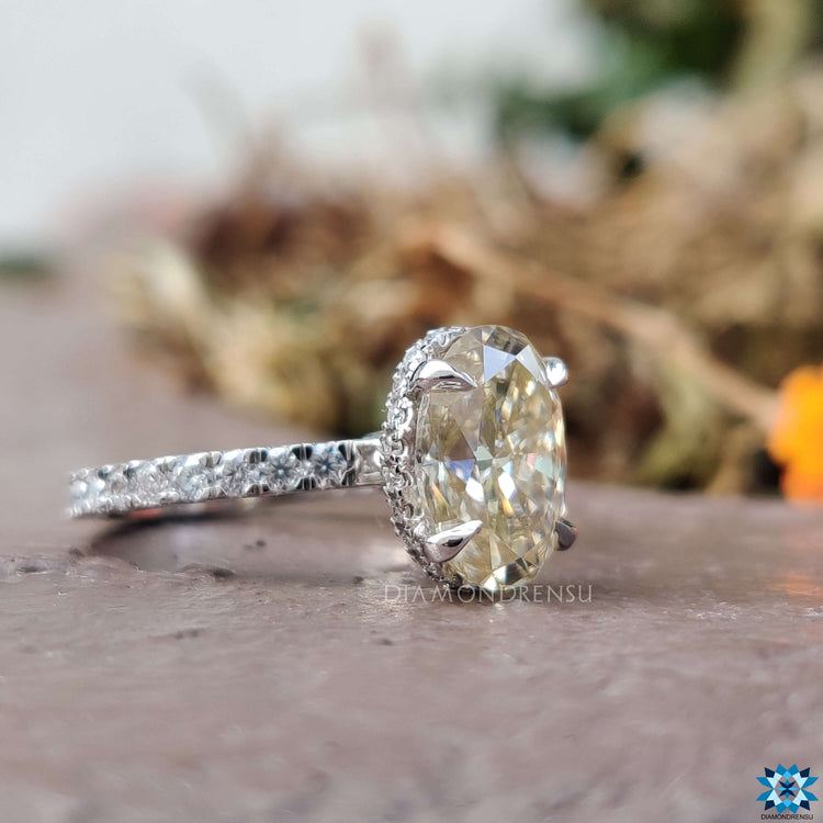Handmade oval moissanite ring with 4 prong claw setting.