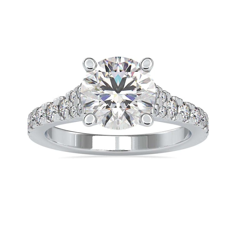 Pave engagement ring with round cut diamond in white gold.