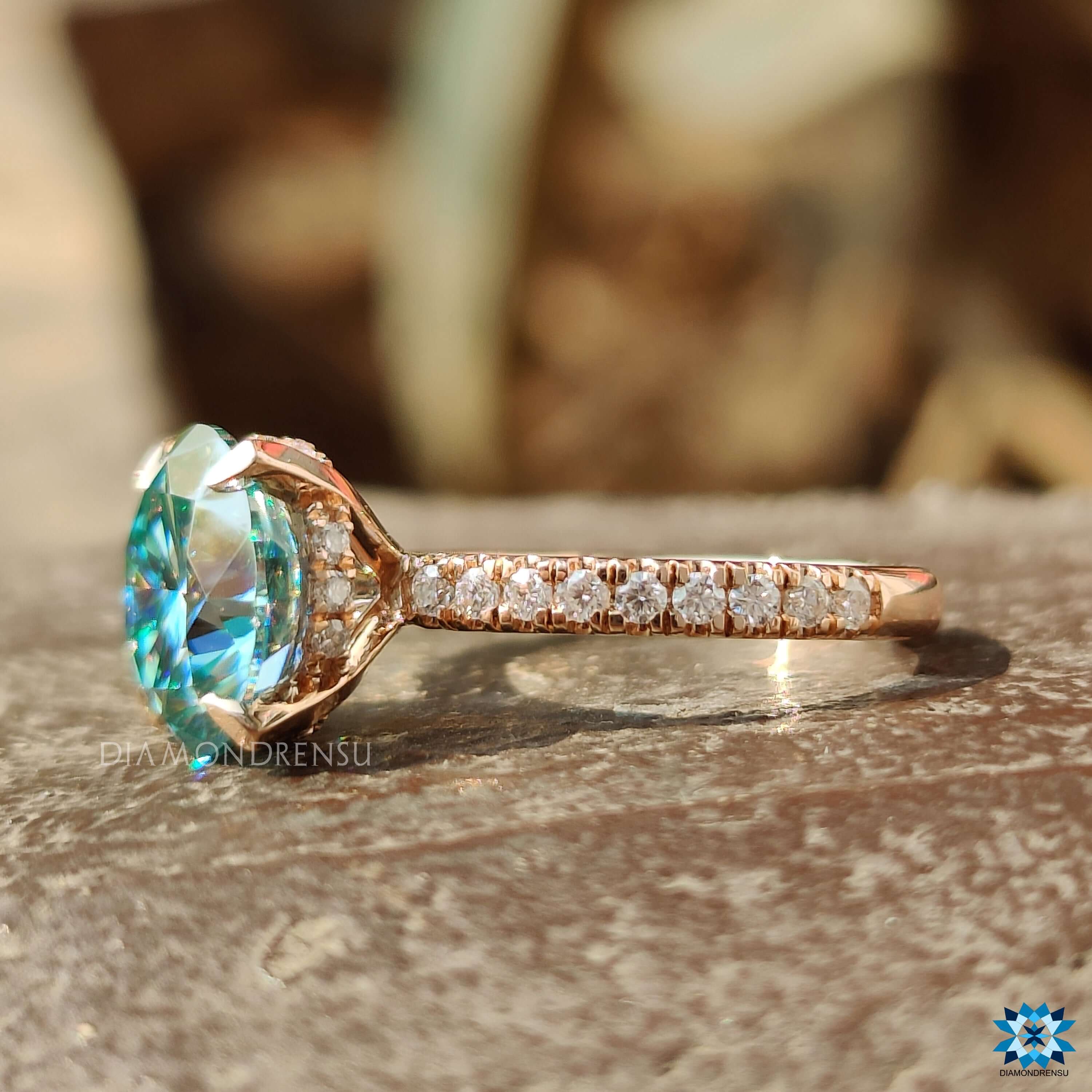 Round cut moissanite ring with pave setting and hidden halo.