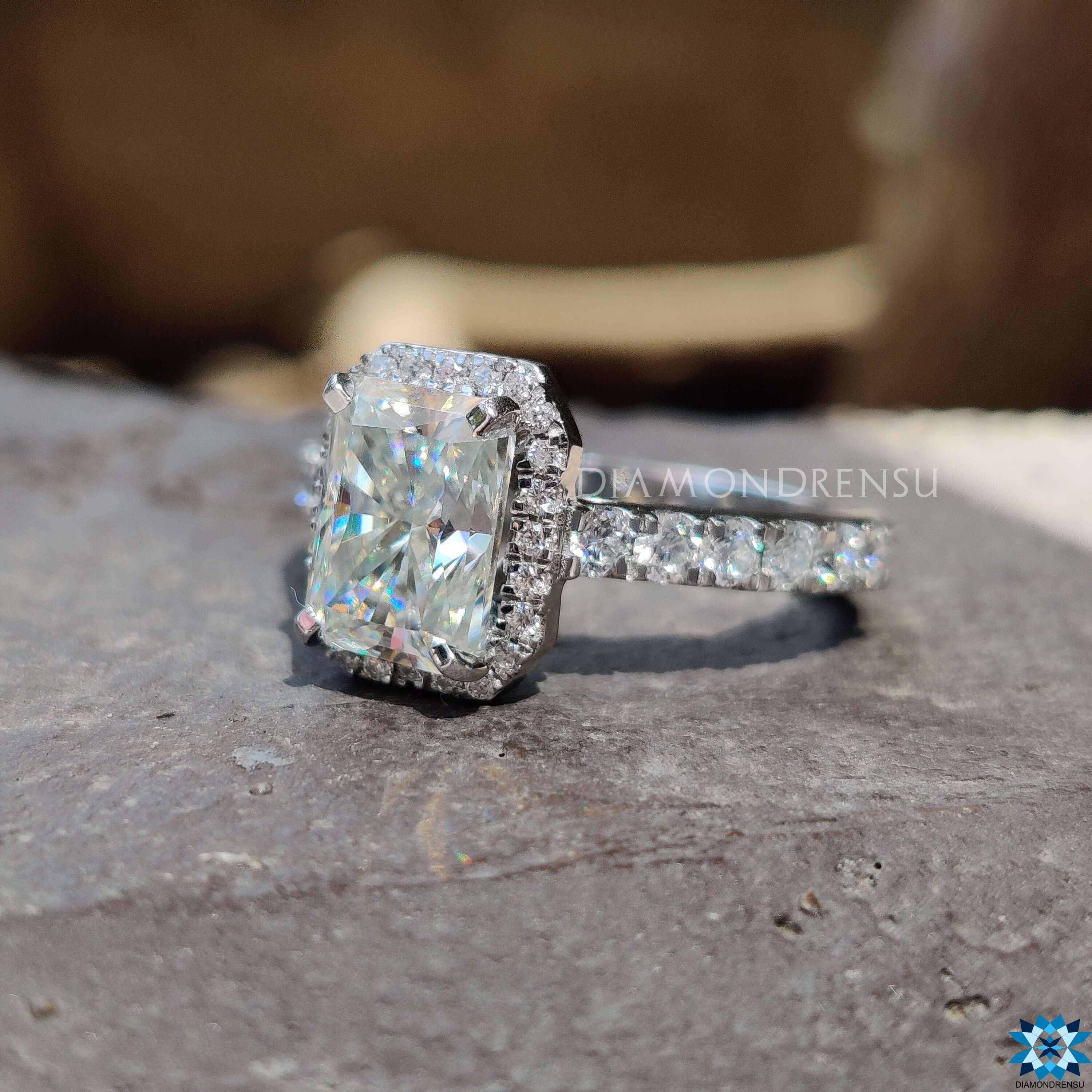 Handmade radiant moissanite ring with pave and prong setting.