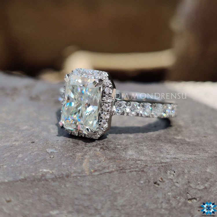Handmade radiant moissanite ring with pave and prong setting.
