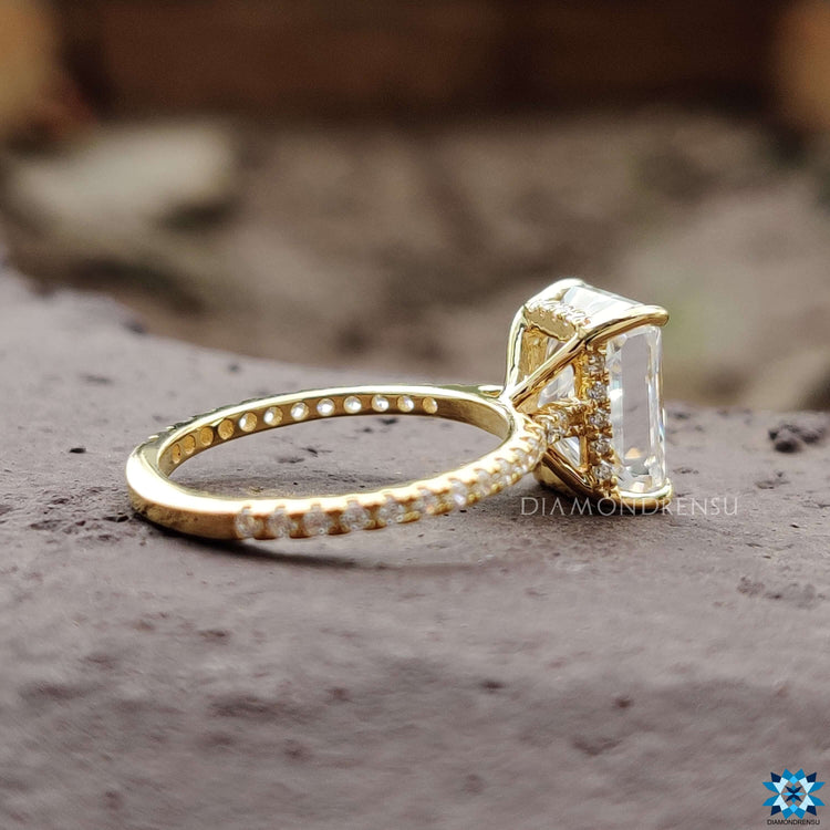 Hidden halo engagement ring with radiant cut stone.